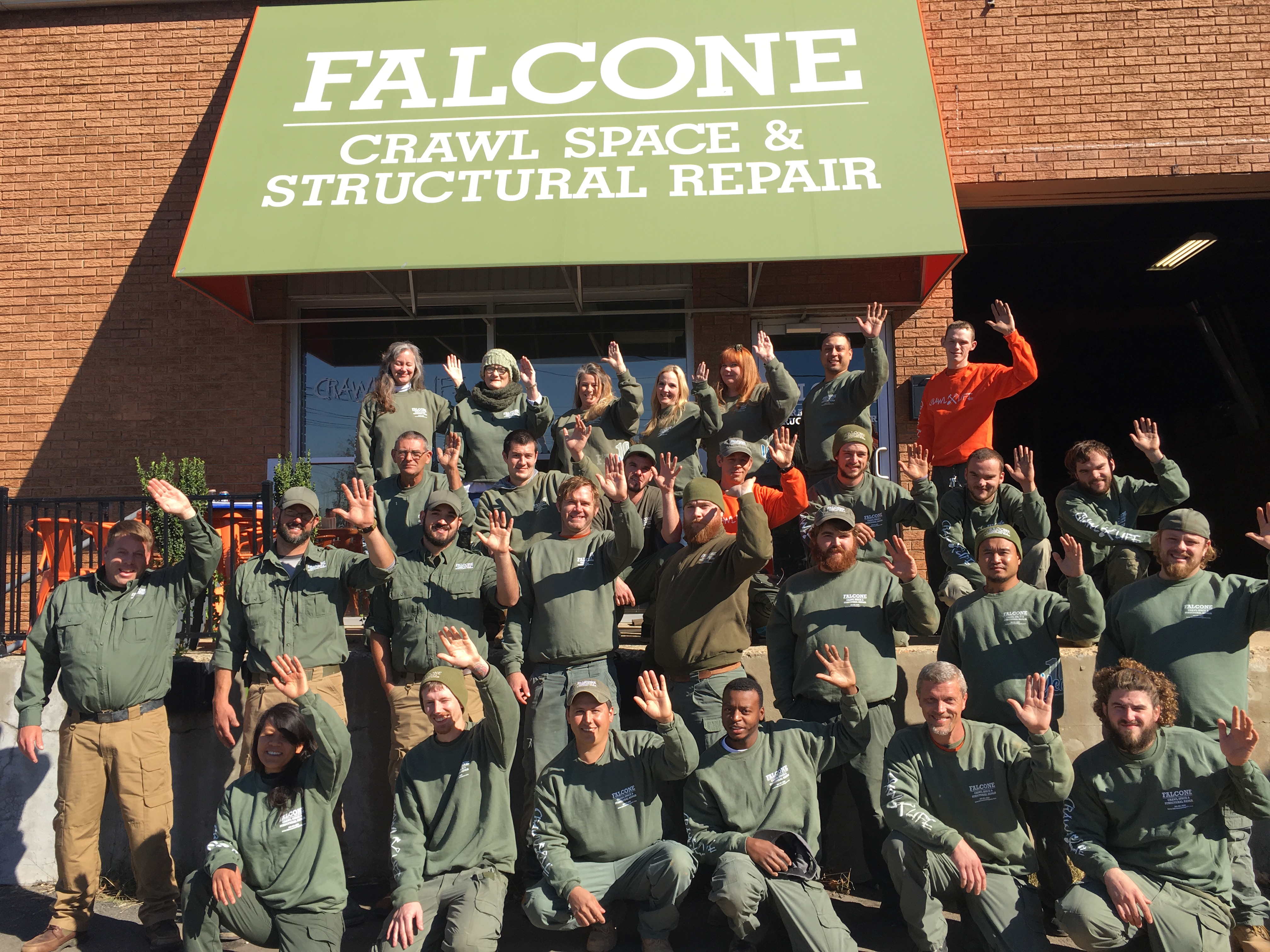 falcone-team-waving-outside